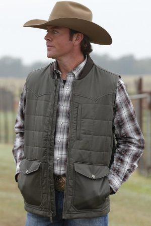A Men Wearing A Cowboy Style Outfits and outwear wear is Gray Vest look very Comfortable