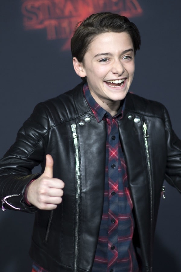 Actor Noah Schnapp Wearing Biker Style Black Leather Jacket In Stranger Things Event Show