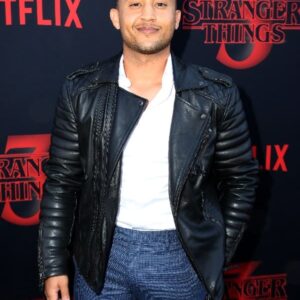Tahj Mowry Wearing A Black Leather Jacket at an event for Stranger Things 