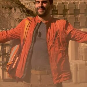 Actor Ignacio Serricchio Wearing Orange Jacket In Lost in Space