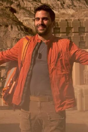 Actor Ignacio Serricchio Wearing Orange Jacket In Lost in Space