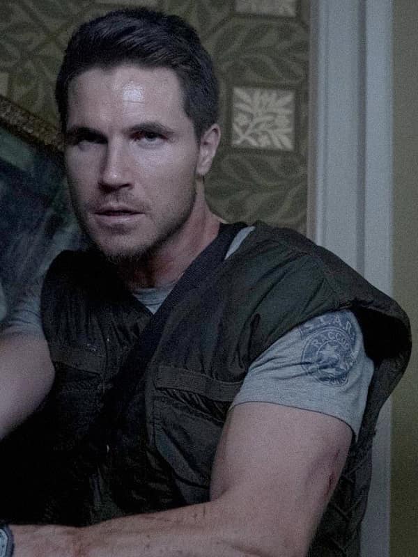 Robbie Amell Wearing Vest In Resident Evil: Welcome to Raccoon City as Chris Redfield