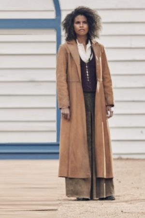 Actress Zazie Beetz Wearing Brown Coat In The Harder They Fall as Mary Fields