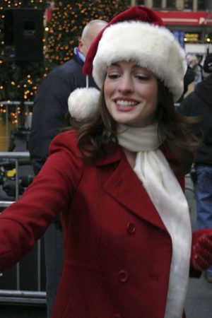 Actress Anne Hathaway Wearing Red Wool Coat at Christmas