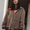 Actress Kelsey Asbille Wearing Brown Hoodie Jacket In Yellowstone as Monica Dutton